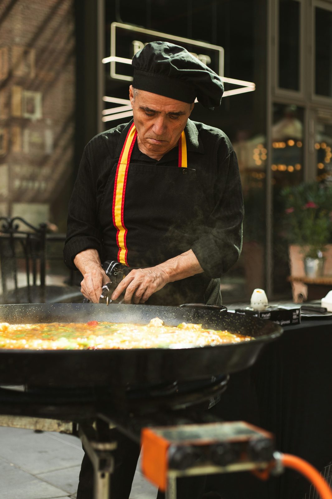 Chef tending a giant paella