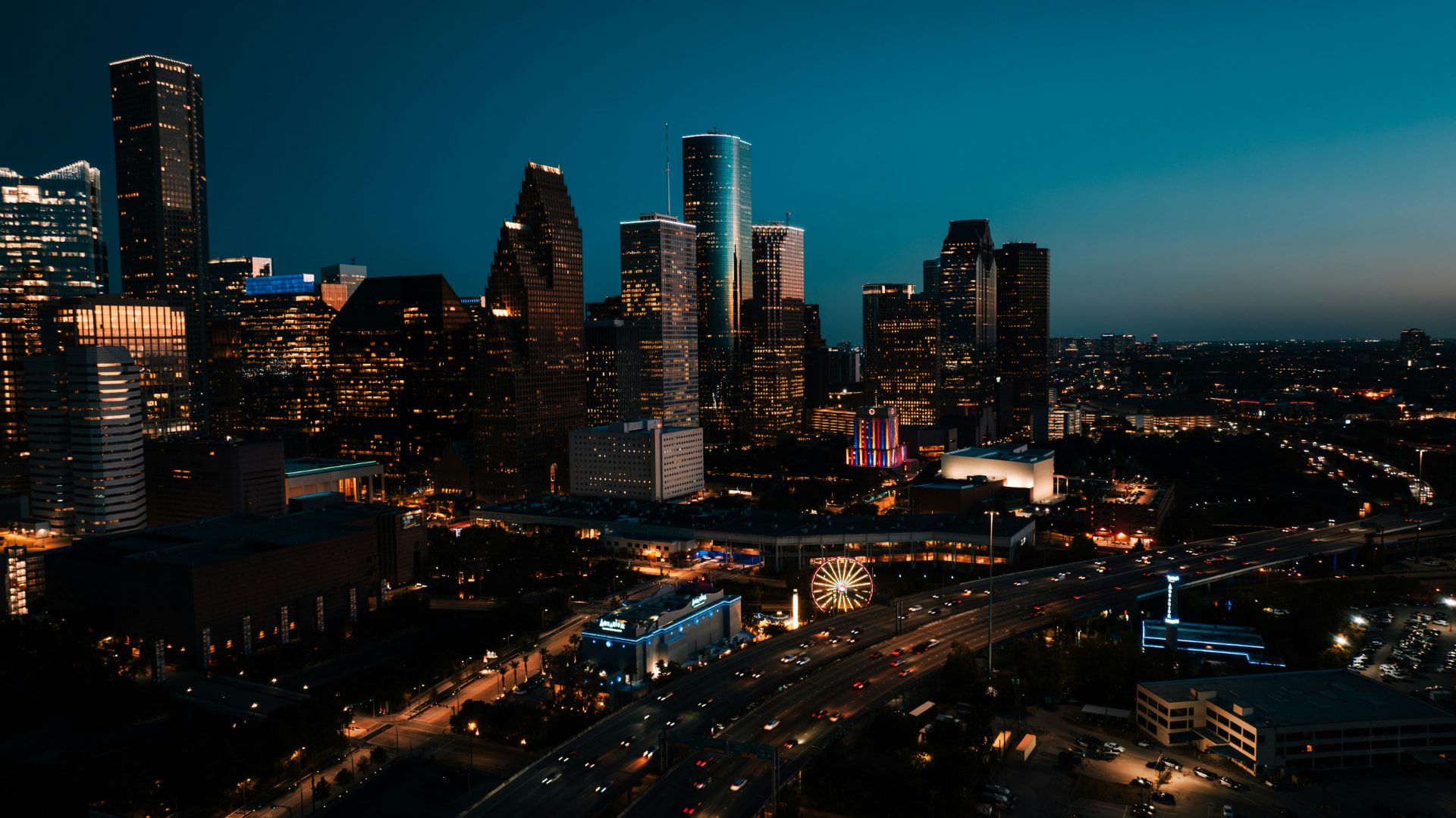 Downtown Houston skyline lit up at dusk